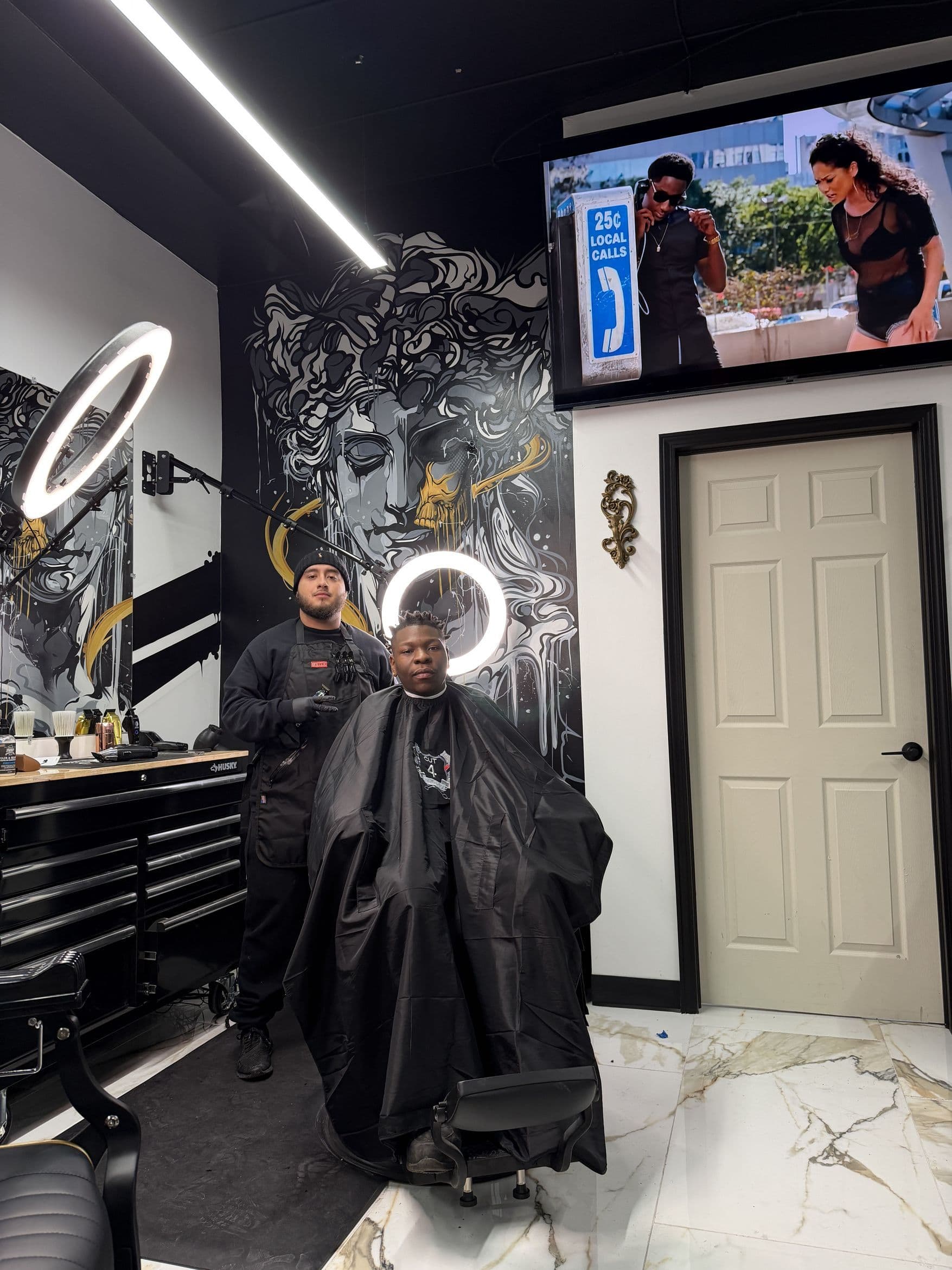 Aces Barbershop photo with Juju Fades