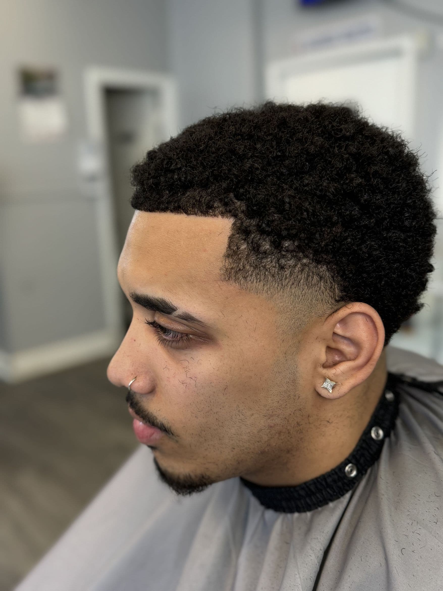 Fade haircut by Juju Fades at Aces Barbershop