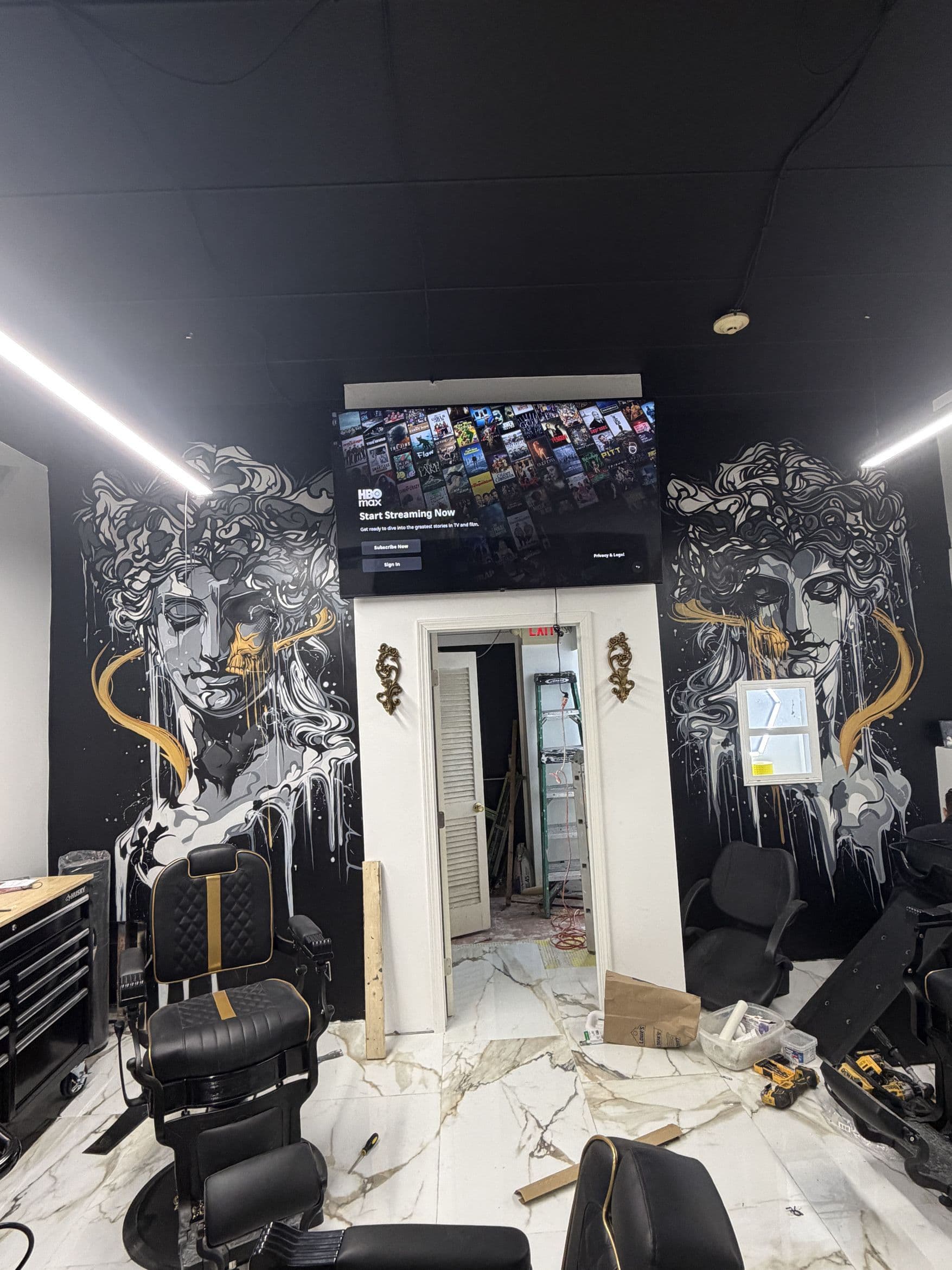 Aces Barbershop wall inside the North Providence shop