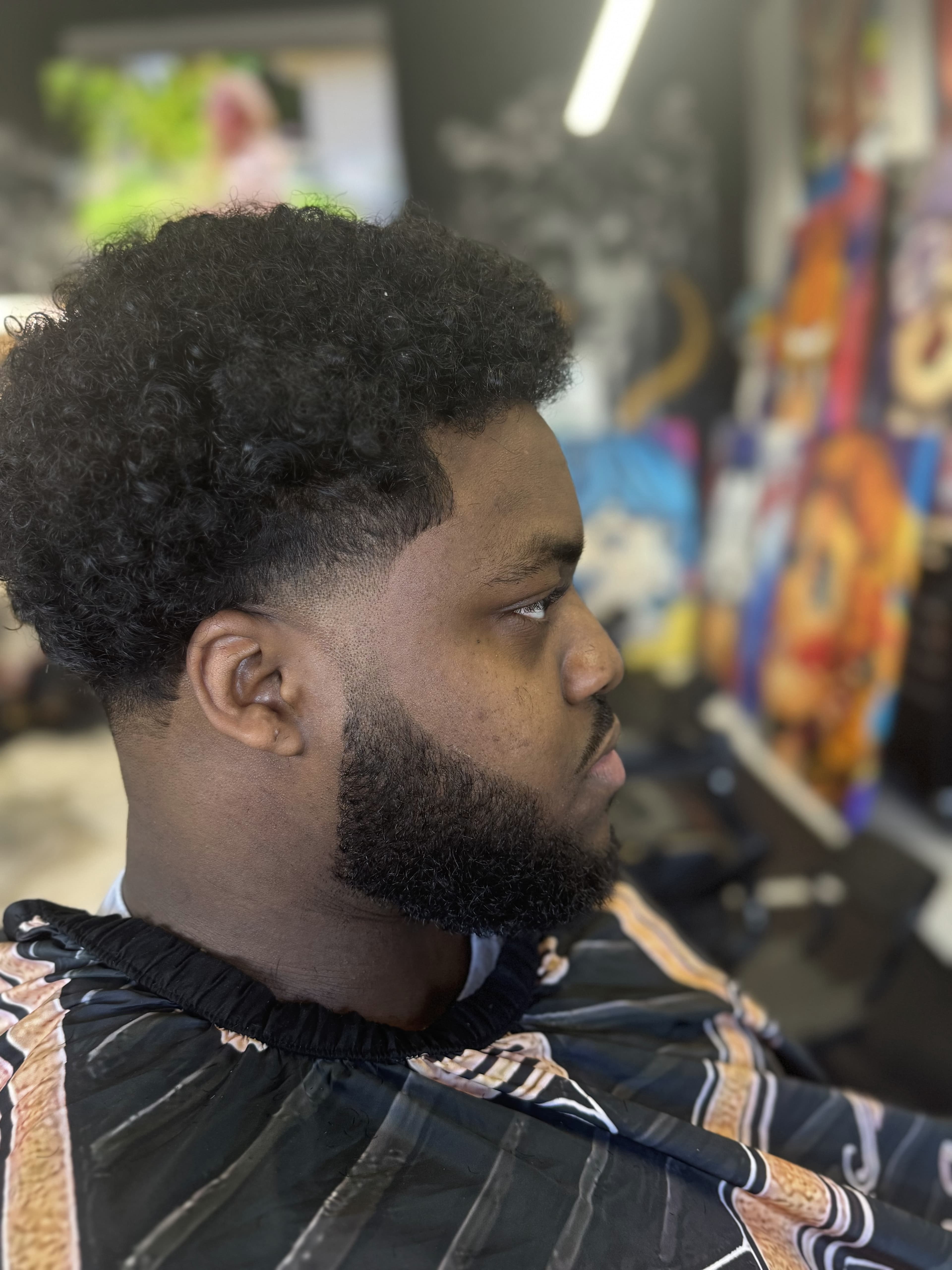 Close-up haircut and beard lineup at Aces Barbershop
