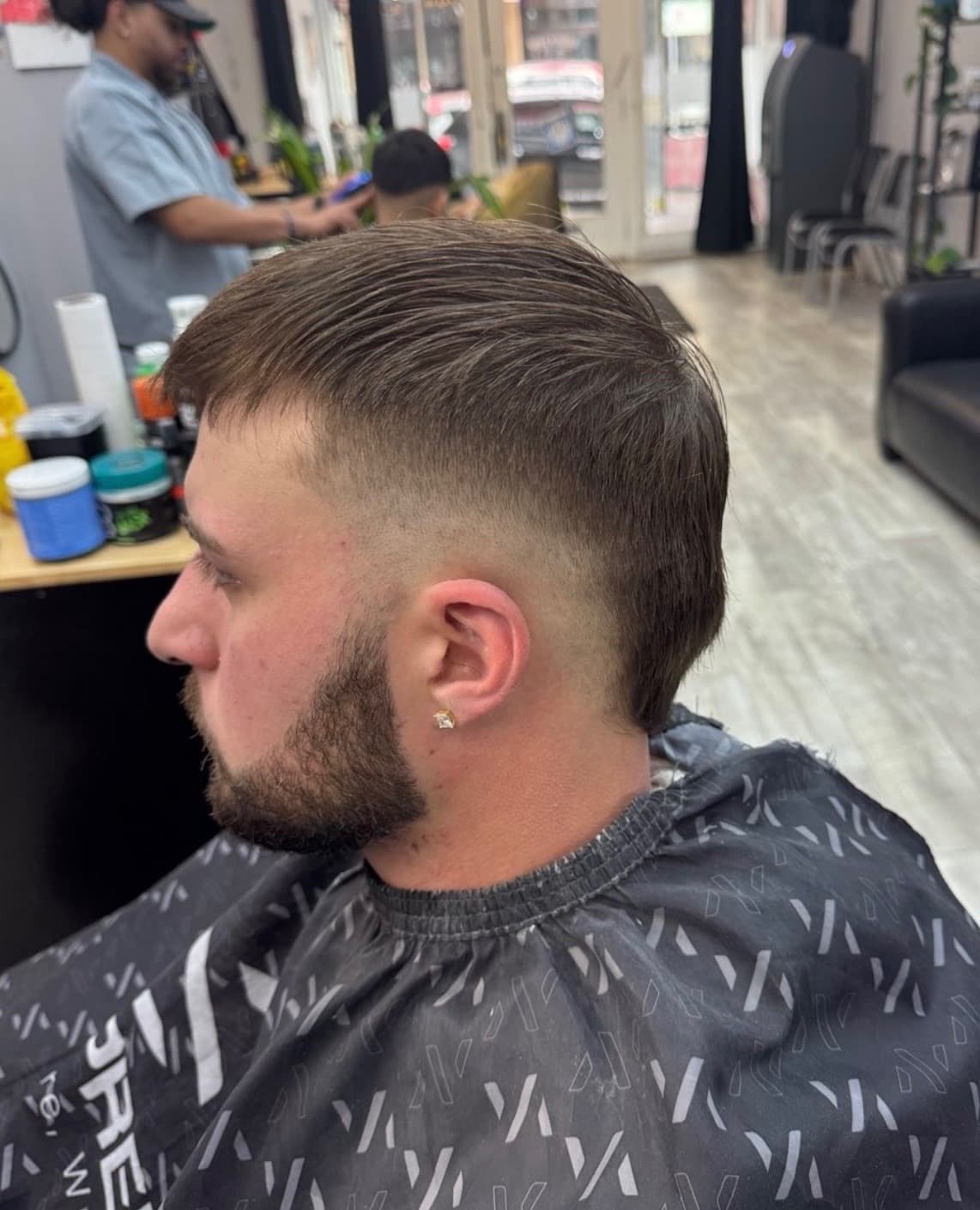 Low taper haircut with beard by Mermelada at Aces Barbershop