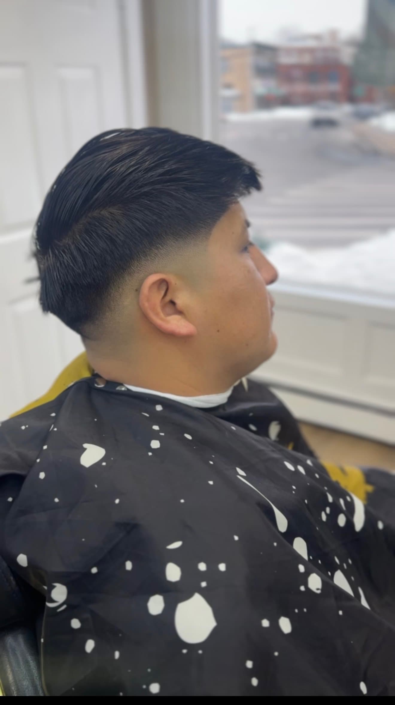 Side part fade haircut by Mermelada at Aces Barbershop