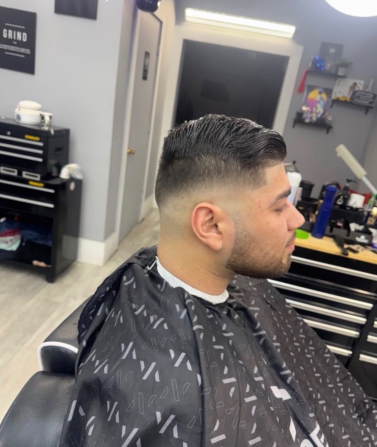 Slick back fade and beard haircut by Mermelada at Aces Barbershop