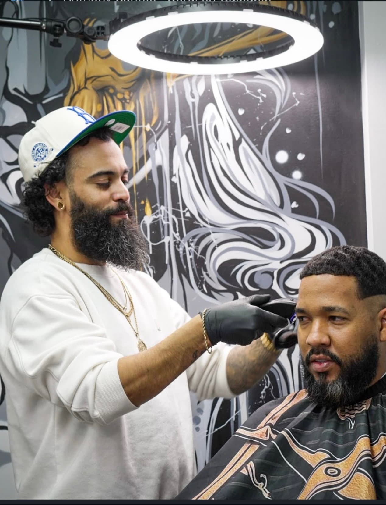 Beard trim and haircut in progress at Aces Barbershop